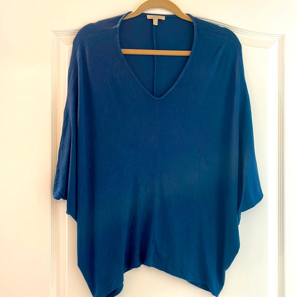 Flattering teal sweater generously sized